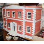 A doll's house of Georgian design, 36" wide x 24" high, and a collection of doll's house furniture