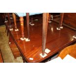 A William IV period mahogany extending table, fitted two leaves, on turned and reeded supports,