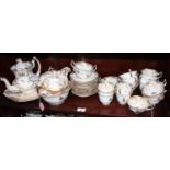A Rockingham porcelain tea service comprising teapot, slop bowl, lidded sucrier, two cake plates,