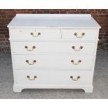 A white painted pine chest of two short and three long drawers with brass loop handles, 40" wide