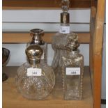 A Victorian cut glass scent bomb with silver top, a cut glass thistle-shape decanter with silver