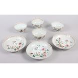 A set of four Chinese tea bowls with floral and scroll decoration, and three matching dishes (