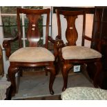 A set of eight Queen Anne design dining chairs with plain vase splats and stuffed over seats, on