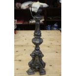 A 19th century Italian carved silvered wood pricket candlestick, on tripod base, 26" high