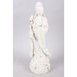 A 20th century blanc de chine figure of Kuan Yin, 11" high, three Chinese porcelain tea bowls, a