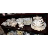 A Rockingham porcelain tea and coffee set, decorated in gilt with small green leaves, comprising