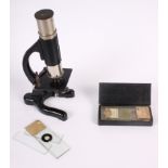 A student's travelling microscope with microscope slides, 6 3/4"
