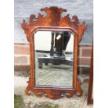 A mahogany framed wall mirror of early Georgian design with shaped plate, 13" x 8 1/2"