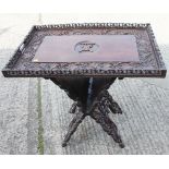 A butler's Far Eastern carved hardwood tray, 29 1/2" wide (damages), on folding stand