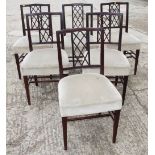 A set of six mahogany standard dining chairs with lattice splat backs and stuffed over seats, on