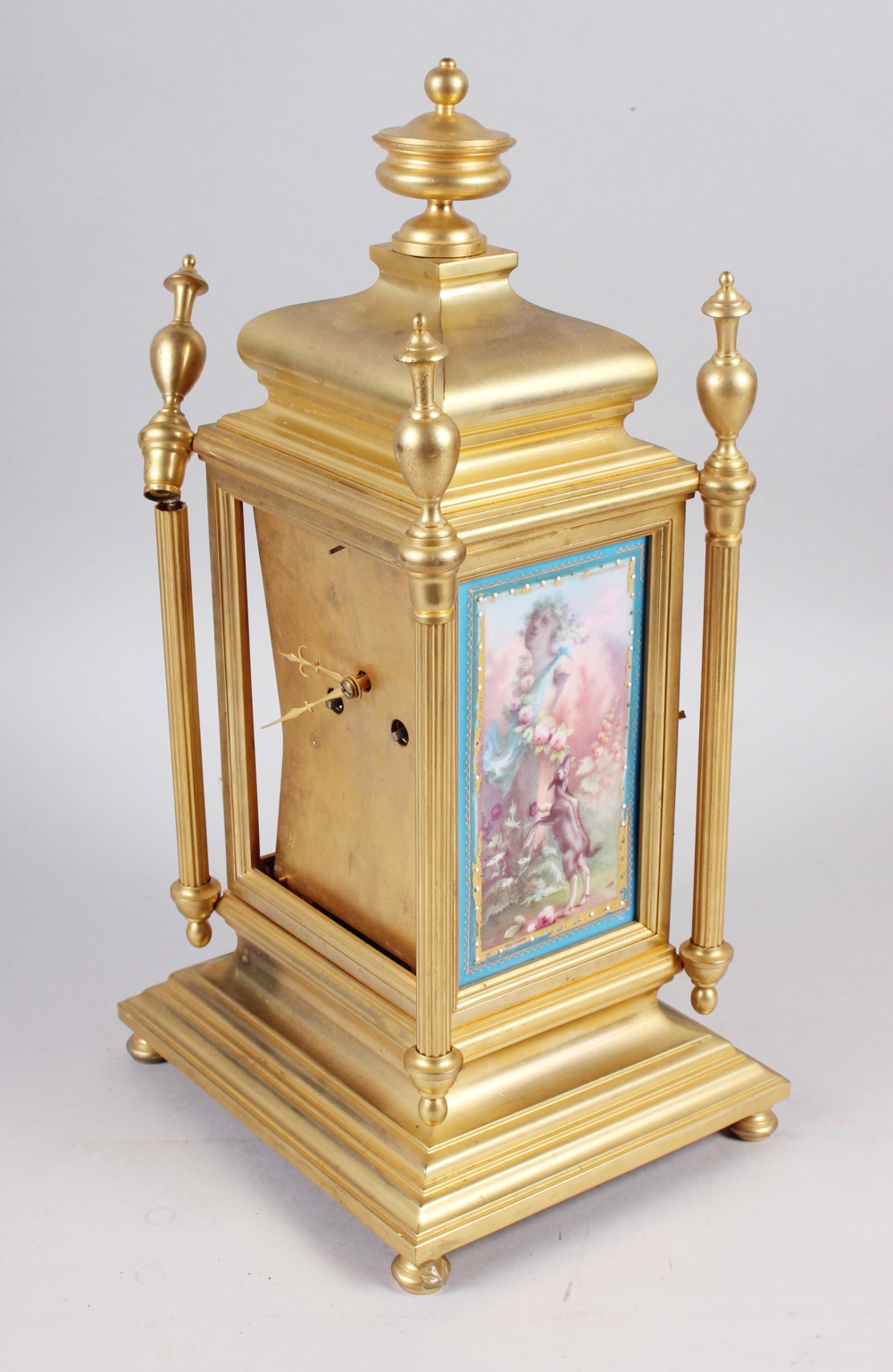A gilt metal Continental mantel clock with hand-painted porcelain panel, 15 1/4" high (for