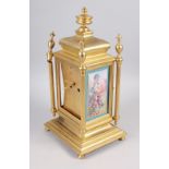 A gilt metal Continental mantel clock with hand-painted porcelain panel, 15 1/4" high (for