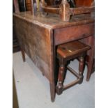 An early 20th century oak Pembroke table, on turned supports, 36" wide x 22" deep x 28" high