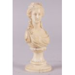 A 19th century carved ivory portrait bust of Marie Antoinette, on turned column, 4 3/4" high (age