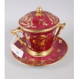 A Limoges two handle cabinet cup, saucer and cover with gilt decoration and crimson ground, 7" high