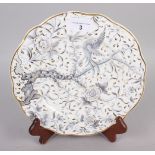 A Rockingham dessert plate, decorated bird, tree and foliage in grey and gilt, 9" dia, puce