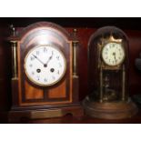 An anniversary clock with enamel dial and Arabic numerals, 11" high, and an Edwardian mahogany and