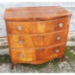 A late Victorian mahogany bowfront chest of three long drawers with oval handle plates, 36" wide x