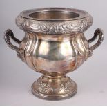 A silver plated two-handled wine cooler with embossed decoration, 9" high