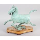 A patinated bronze model of the flying horse of Kansu, on hardwood stand, 10 1/2" high