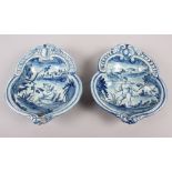 A pair of 19th century Cantagalli blue and white painted dishes with putto decoration (restored)