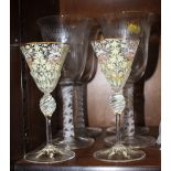A pair of Venetian enamel decorated wine glasses with octagonal bowls, 6" high, and a set of four