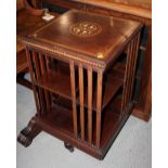An Edwardian walnut and marquetry inlaid revolving bookcase, 19" square x 34" high
