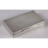 A rectangular solid silver engine turned table cigarette box, 9oz troy approx, Birmingham 1937