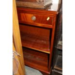 A mahogany low open bookcase, fitted two drawers over open shelves, on bracket feet, 28" wide x 11 "