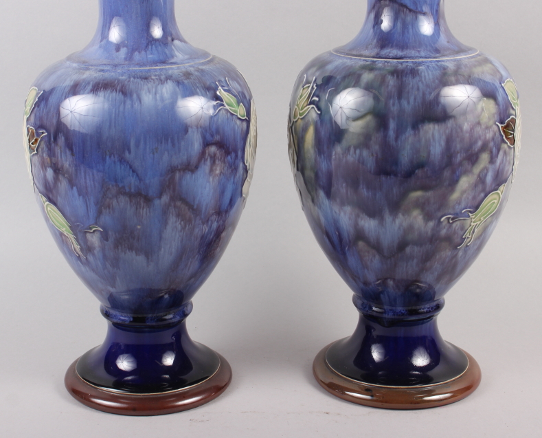 A pair of Royal Doulton blue glazed vases with flared tops and ovoid bodies, tub lined decoration of - Image 2 of 5