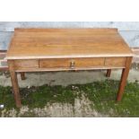 An oak low side table with raised back, fitted one drawer, on square taper supports, 36" wide