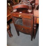 A late Georgian mahogany washstand, fitted tambour shutter over pull-out night stool and cover, on