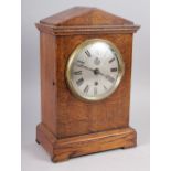 An oak cased mantel clock with silvered dial, etched "RAF" and Roman numerals, 14" high