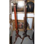 A mahogany standard lamp with turned fluted column and carved acanthus and wheat decoration, on