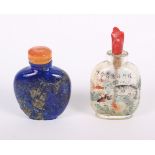 A Chinese carved lapis lazuli snuff bottle, decorated with a bird on a branch to one side and figure