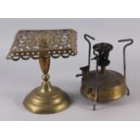 A brass stand with pierced decoration, 9" high, a similar rectangular copper stand, two brass