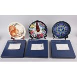 A Moorcroft edition Centennial plate and two Moorcroft year plates, 1995 and a 1996 boxed