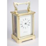 A brass cased carriage clock by H Samuel