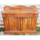A late Victorian walnut serpentine front chiffonier with ledge back, fitted one drawer over