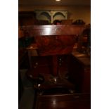 A Victorian mahogany work table, fitted two drawers, on faceted column and quatreform base with