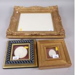 Two Grand Tour style plaster cameos, in gilt frames, and an ornate gilt picture frame