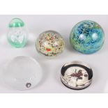 A Mdina glass paperweight and four other paperweights, various