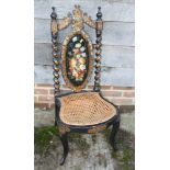 A mid 19th century papier-mache black japanned and mother-of-pearl inlaid splat back low seat