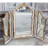 A floral design gilt decorated triple plate swing frame toilet mirror, plate 26" x 23"