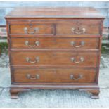 A bachelor's Georgian mahogany chest of two short and three long drawers with brushing slide over,