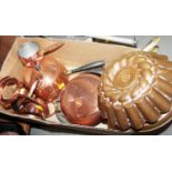 Two copper jelly moulds, a brandy warmer cover and stand, a fondue set and two copper pans