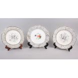A pair of Rockingham porcelain dessert plates with grey and gilt decorated floral borders and