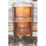A Victorian walnut three-tier whatnot with fretted gallery, on bobbin turned supports, 14 3/4" wide,
