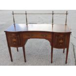 A Sheraton revival mahogany satinwood banded and inlaid shape front sideboard with brass gallery