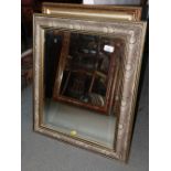 A rectangular wall mirror, bevelled plate 19 1/2" x 15 1/4", in Liberty peacock feather frame